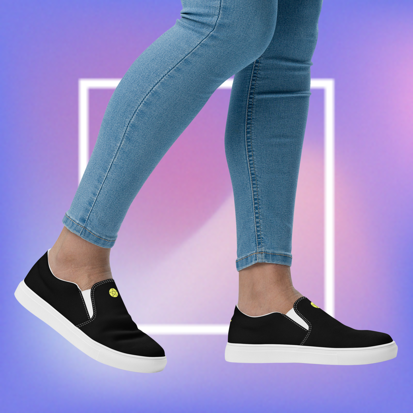 Women's black slip-ons featuring a yellow printed pentacle star in the center tongue of the shoe and a signature star initialed CS in the center back of the shoe.
