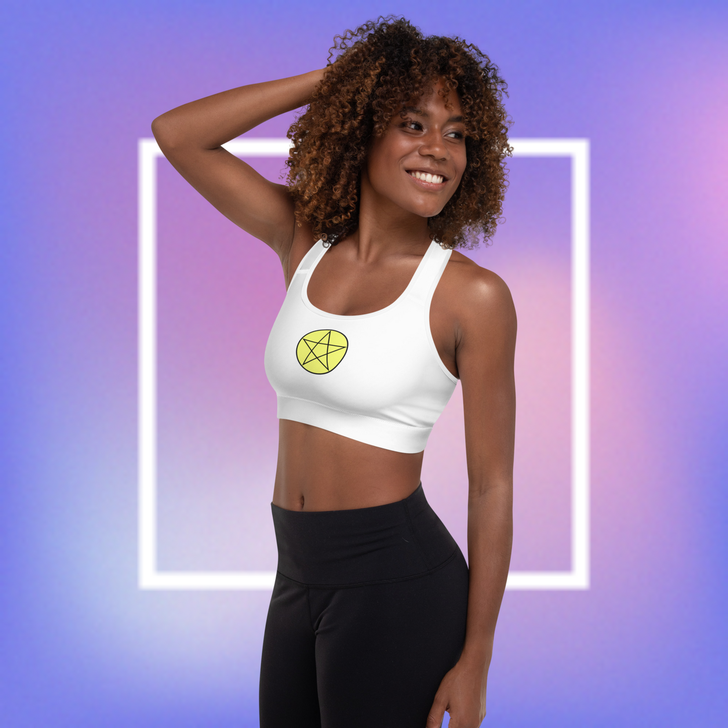 Women's white sports bra with a yellow center printed pentacle star in the front and a white angel wing and purple demon wing in the back.