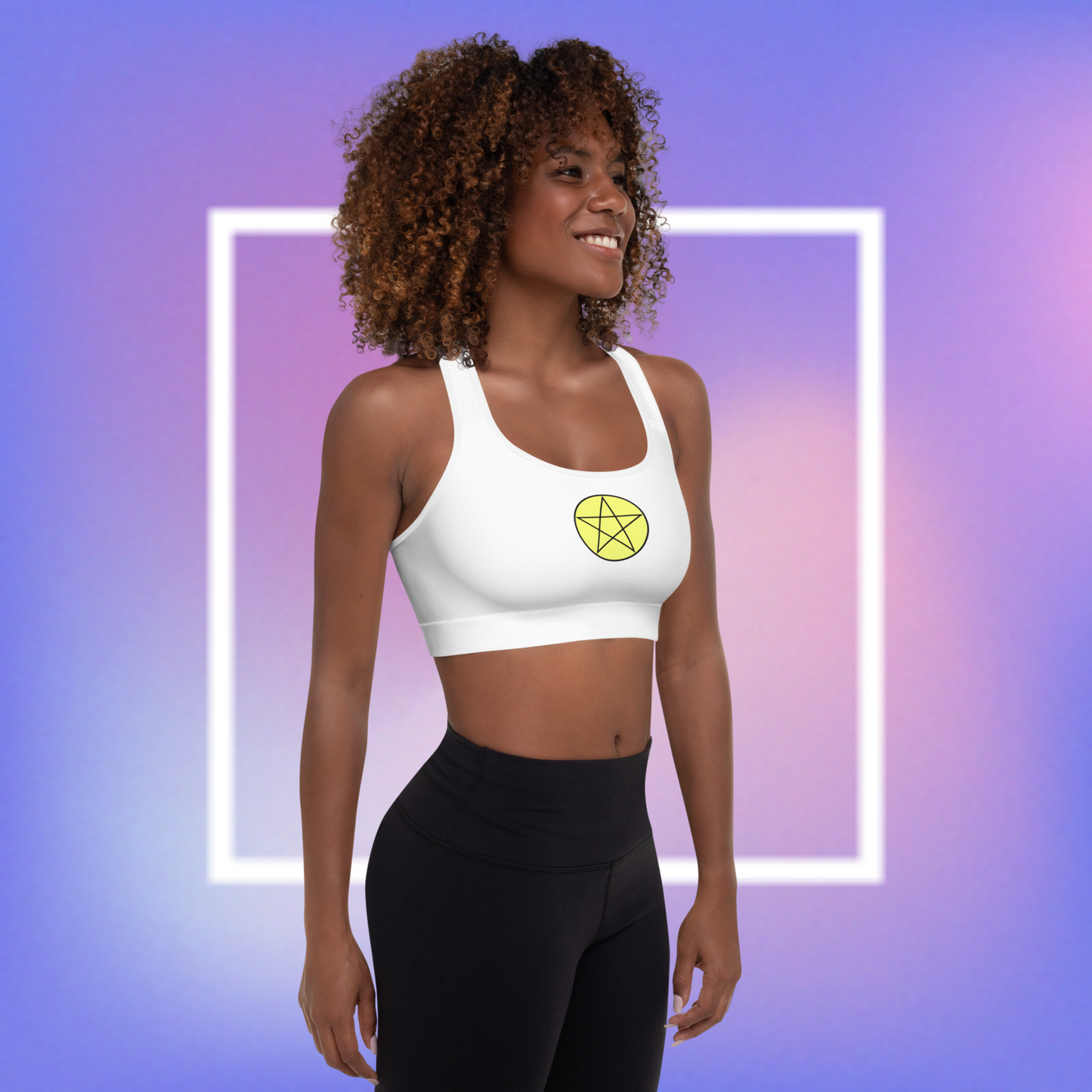 Women's white sports bra with a yellow center printed pentacle star in the front and a white angel wing and purple demon wing in the back.