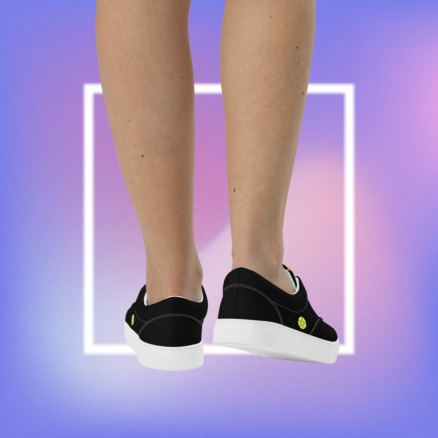 Women's black & white sneakers featuring a pentacle star printed on each outer side of the shoe with a center star logoed CS on the tongue.