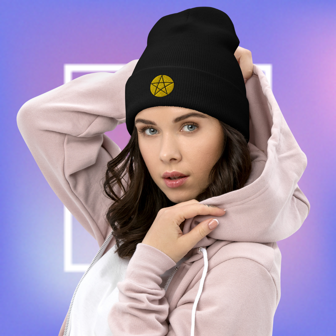 Black beanie with a yellow pentacle star design, for women.