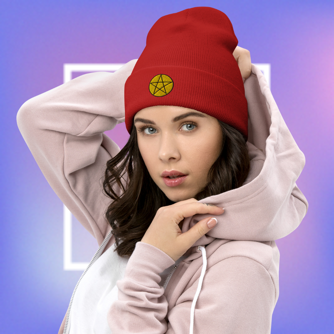 Red beanie with a yellow pentacle star design, for women.