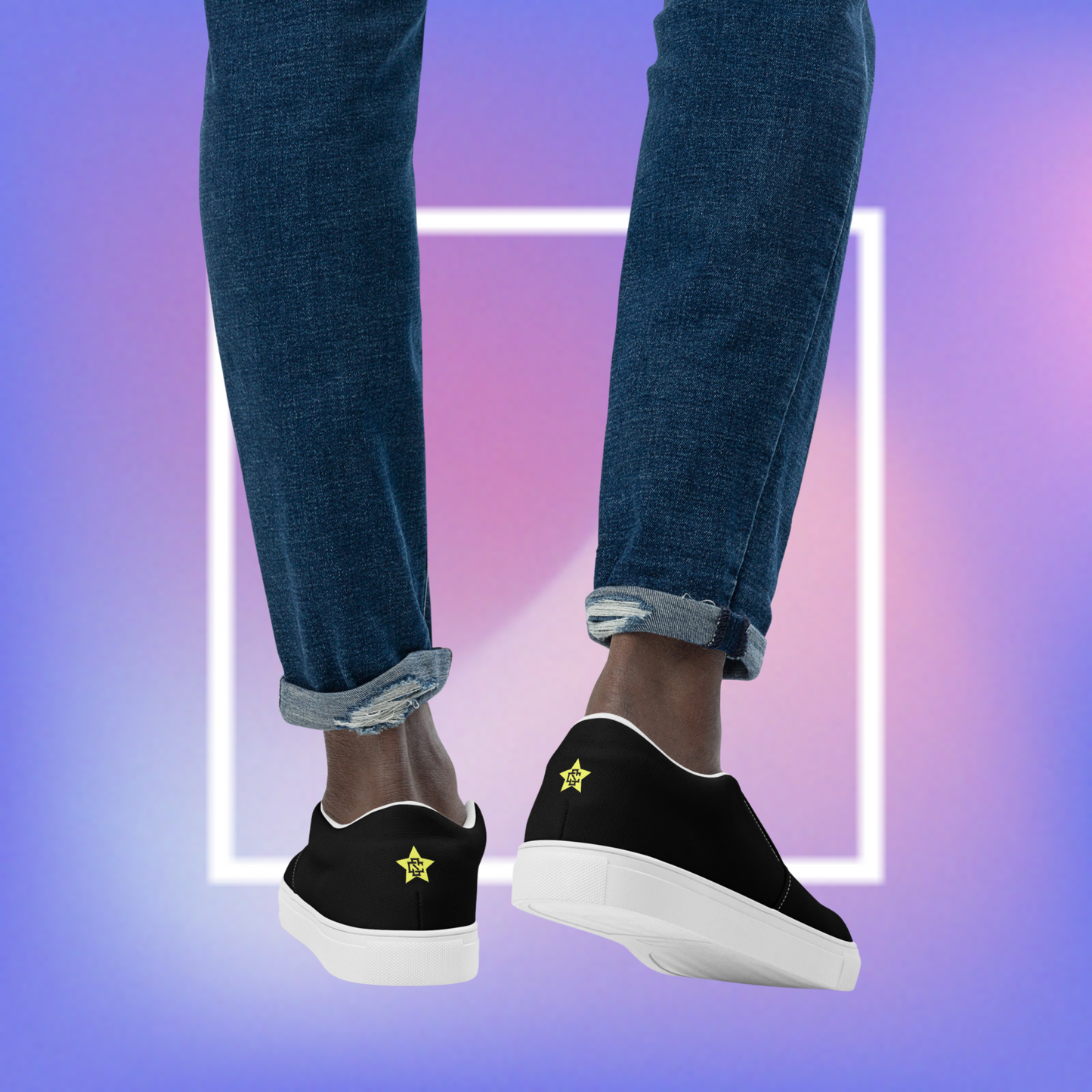 Men's black slip-ons featuring a yellow printed pentacle star in the tongue of the shoe and a signature star initialed CS in the center back of the shoe.  