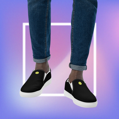 Men's black slip-ons featuring a yellow printed pentacle star in the tongue of the shoe and a signature star initialed CS in the center back of the shoe.  