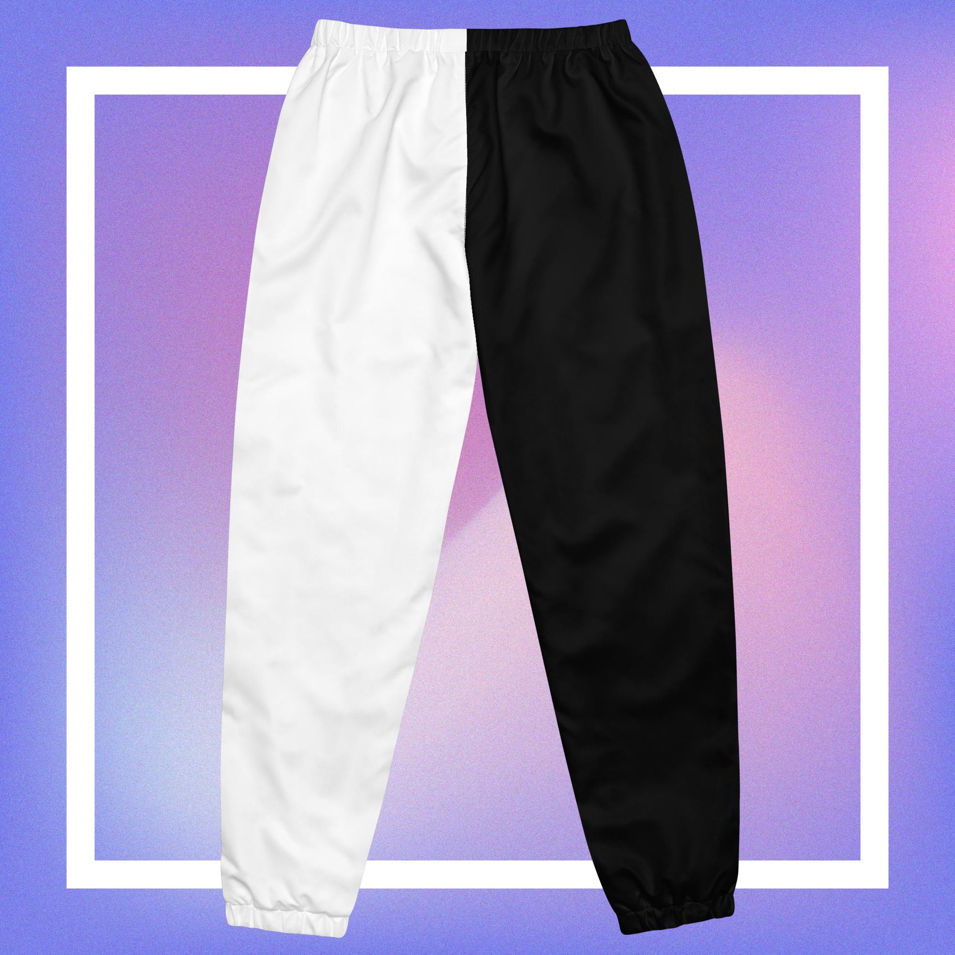 Cozmic Studioz Black and White CS Track Pants for Men. Trendy track pants with CS initials print, showcasing Cozmic Studioz's signature style.