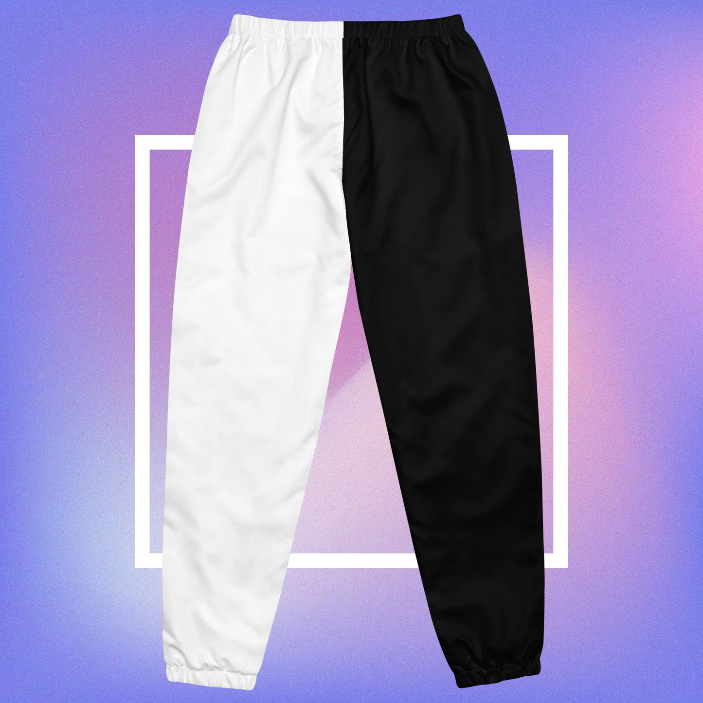 Cozmic Studioz Black and White CS Track Pants for Women. Trendy track pants with CS initials print, showcasing Cozmic Studioz's signature style.