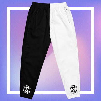 Cozmic Studioz Black and White CS Track Pants for Men. Trendy track pants with CS initials print, showcasing Cozmic Studioz's signature style.