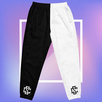 Cozmic Studioz Black and White CS Track Pants for Women. Trendy track pants with CS initials print, showcasing Cozmic Studioz's signature style.