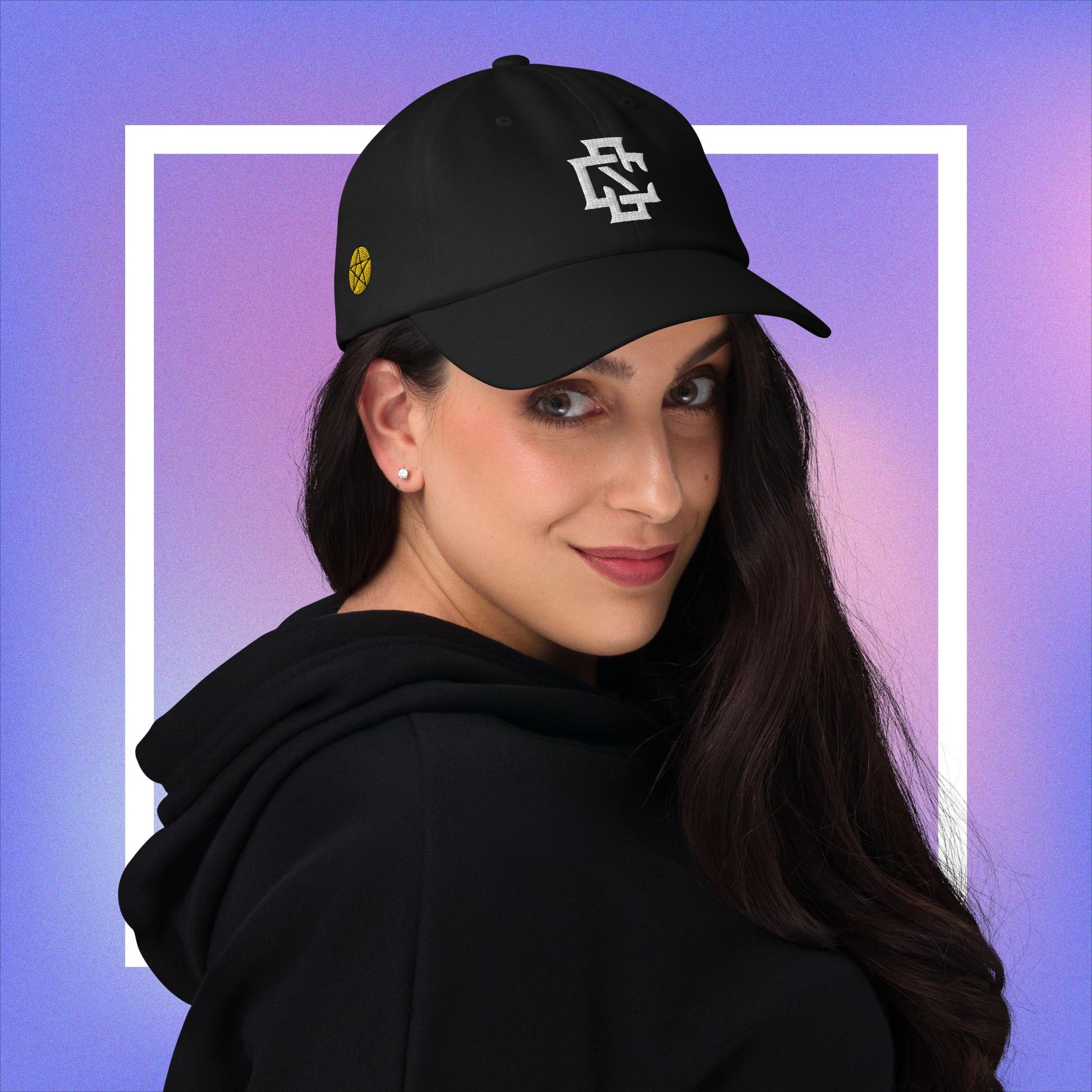 Cozmic Studioz CS Arch Cap for Women: White embroidered CS symbol centered with yellow pentacles on each side of black arched cap.