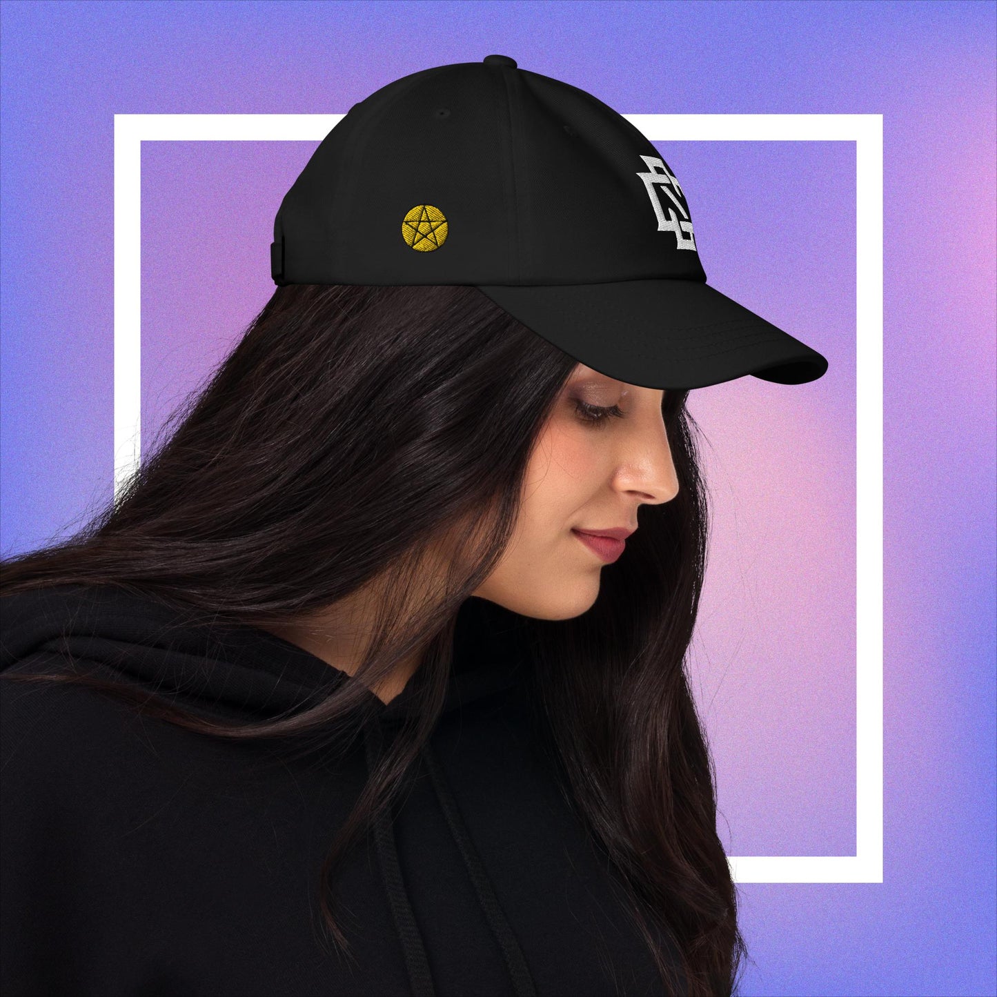 Cozmic Studioz CS Arch Cap for Women: White embroidered CS symbol centered with yellow pentacles on each side of black arched cap.