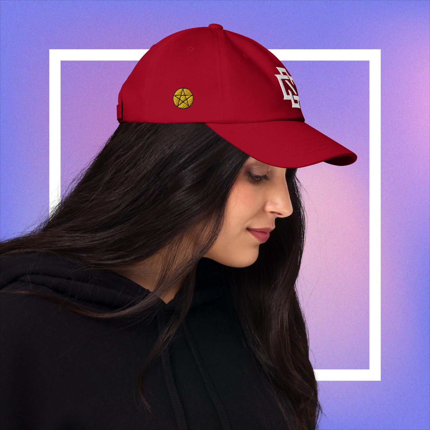 Cozmic Studioz CS Arch Cap for Women: White embroidered CS symbol centered with yellow pentacles on each side of red arched cap.